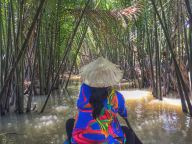 Rowing through Mekong Delta